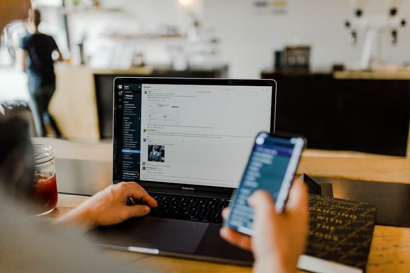Administrator managing secure school software on a laptop