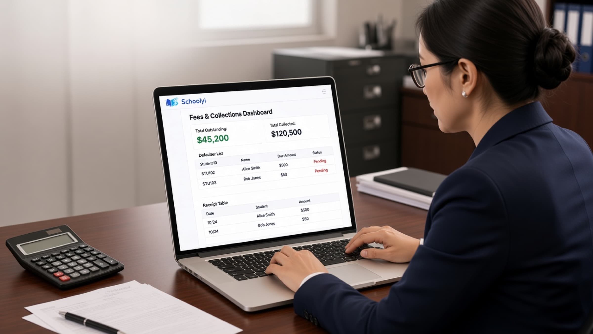 Bursar reviewing fee collections in Schoolyi on a laptop